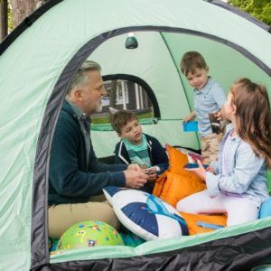 father in a tent with his kids