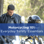 a man standing next to a motorcycle