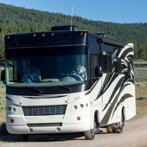 rv traveling through a scenic road