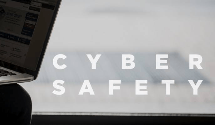 a laptop with text 'cyber safety'