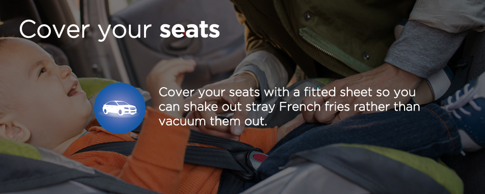 a child in a car seat with text 'cover your seats'
