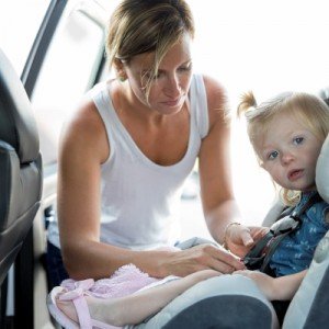 woman with baby in car seat