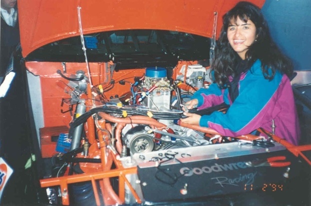 a woman with a car engine