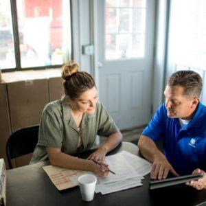 two people reviewing a plan