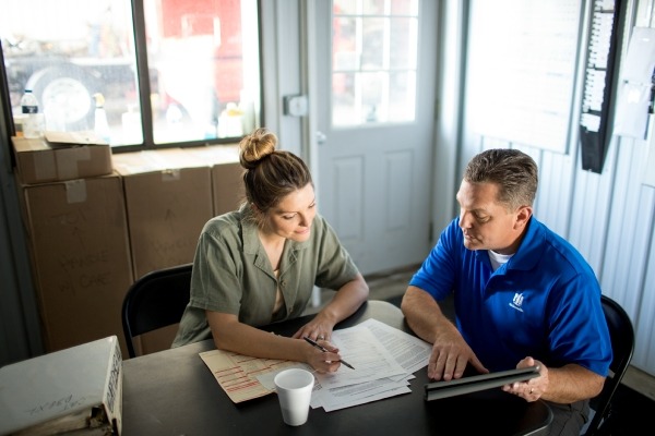 two people reviewing a plan