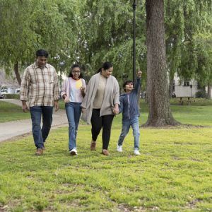 Family Walking Through Park