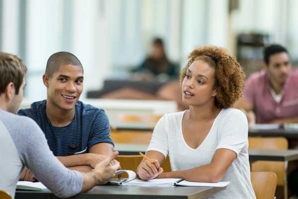 college students talking at a table