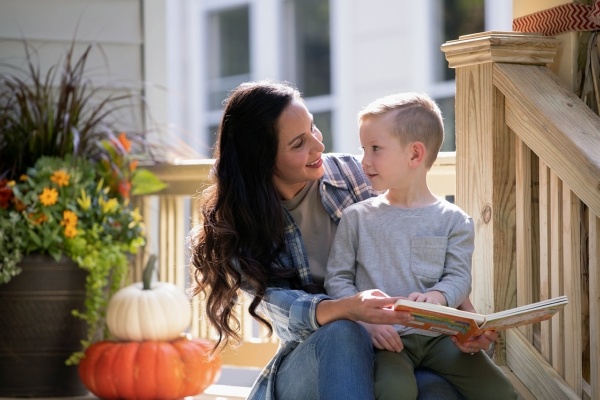 woman sitting on porch with her son