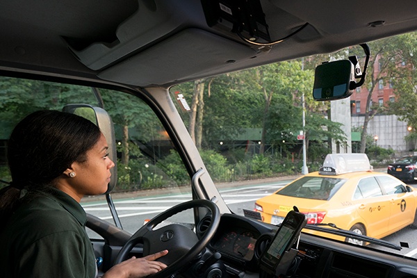 woman driving in city traffic