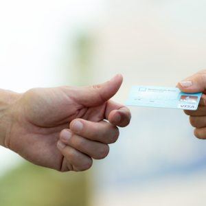 Person Holding Credit Card