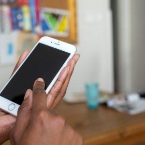 hands holding a cell phone