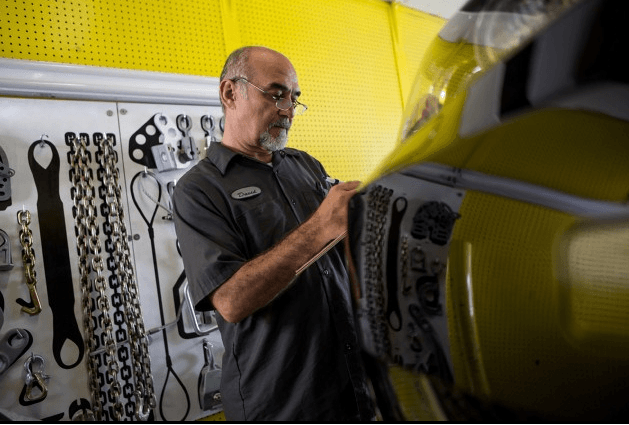 mechanic working on car