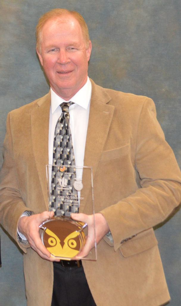 Brad Taylor holding Golden Owl trophy