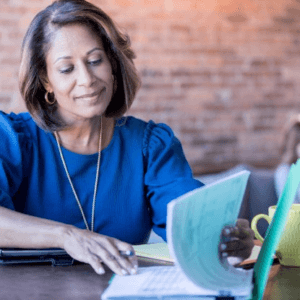Woman reviews insurance bundling paperwork