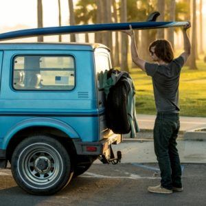 man with an old jeep car