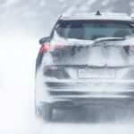 SUV on snow-covered road.