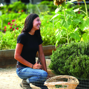 a woman tending to a garden