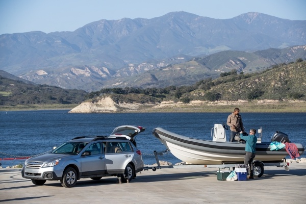 a car towing a boat