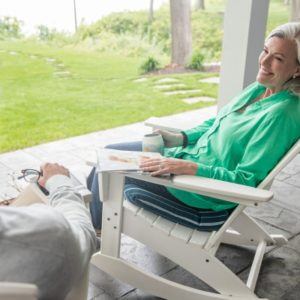 a woman sitting in a rocking chair
