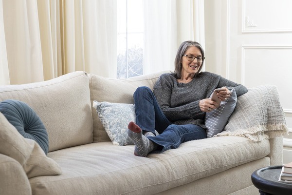 Retired Woman Relaxing in Living Room