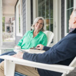 Two senior citizens discuss Medicare FAQs.