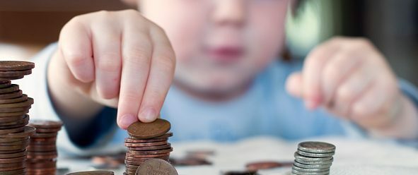 a child picking up a penny