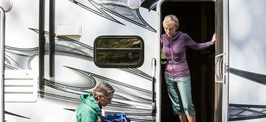 a woman opening a door to an RV