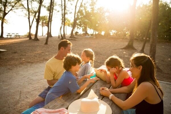 family picnicking at the beach
