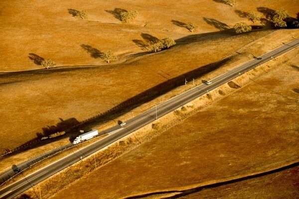 Far away view of tractor trailer on highway