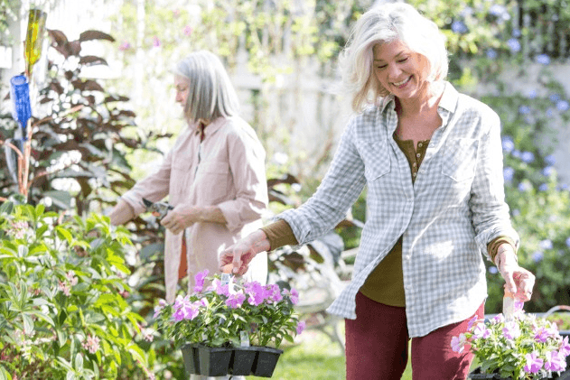 women planting in garden