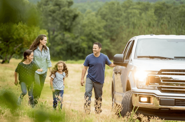 family outside their SUV