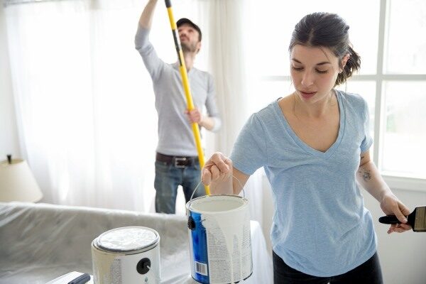 woman and man painting inside the house