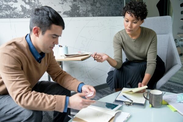 man and woman in a meeting