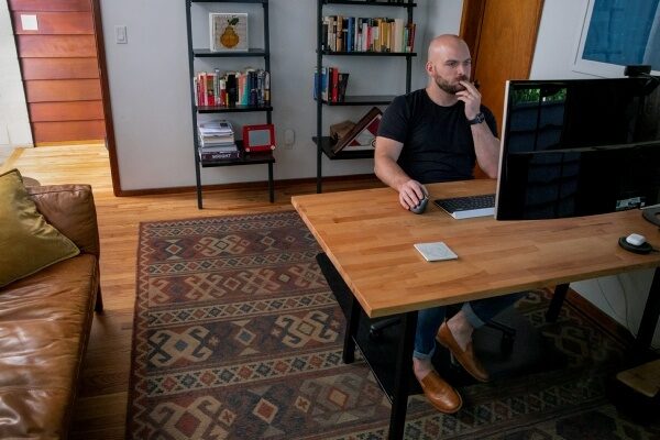 man working at desk in home office