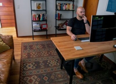man working at desk in home office