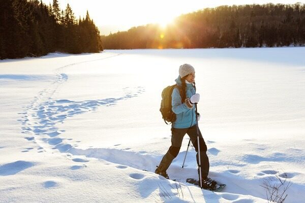 A woman snowshoeing