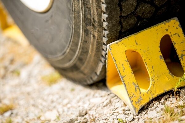 a yellow wheel stopper