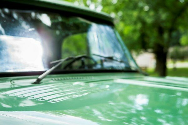 Windshield wipers on green vehicle