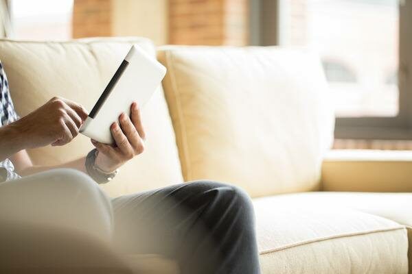 Hand holding tablet e-book reader