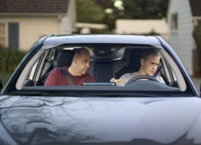 Father Gives Son Driving Lessons