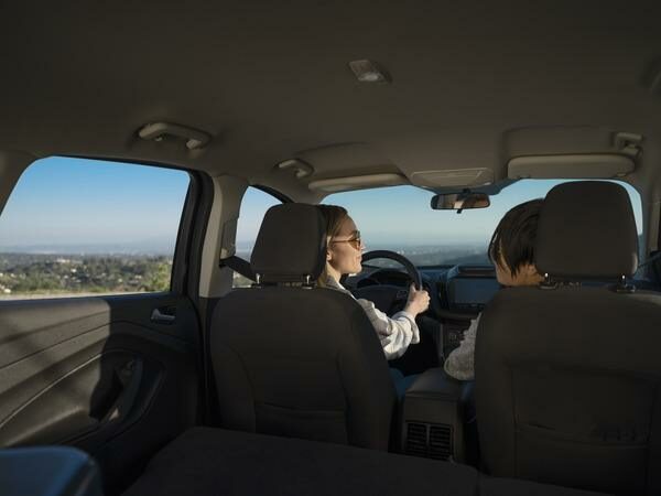 Two People Driving Car