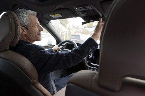 Man Adjusting Rearview Mirror