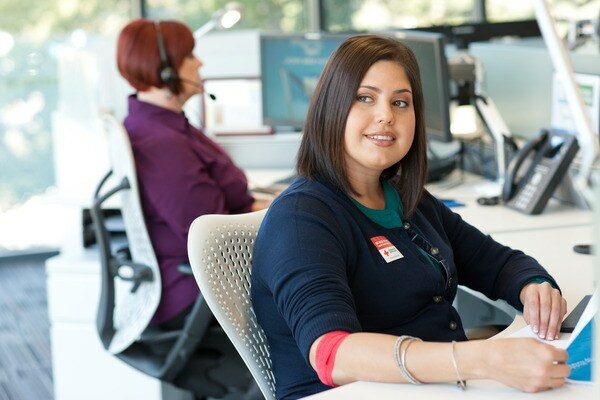 Smiling Employee at Desk