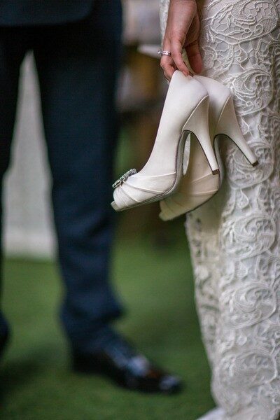 Bride Holding Shoes