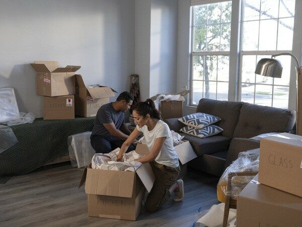 Couple packing in their living room