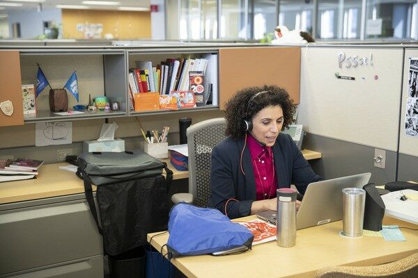 Woman working in her cubicle in the office