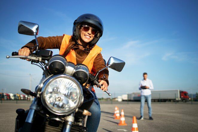 Person taking motorcycle license test.