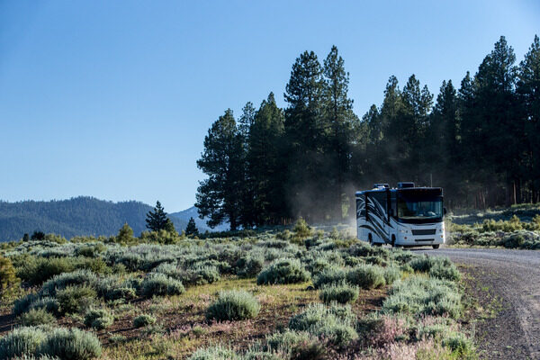 RV driving on an open road during the day