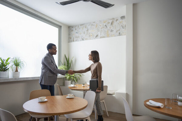 Man and woman shaking hands in an office