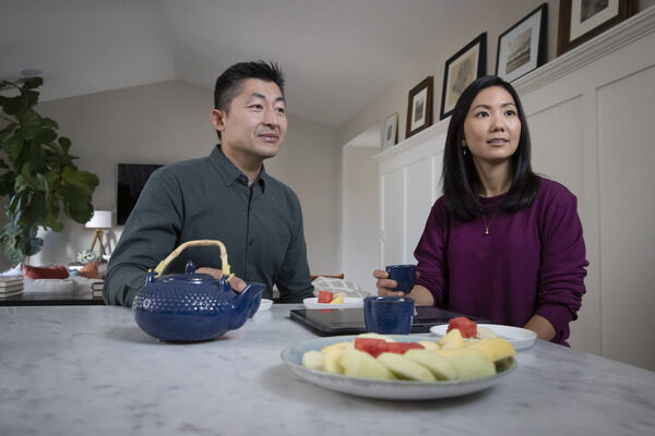 Man and woman sitting at their dining room table